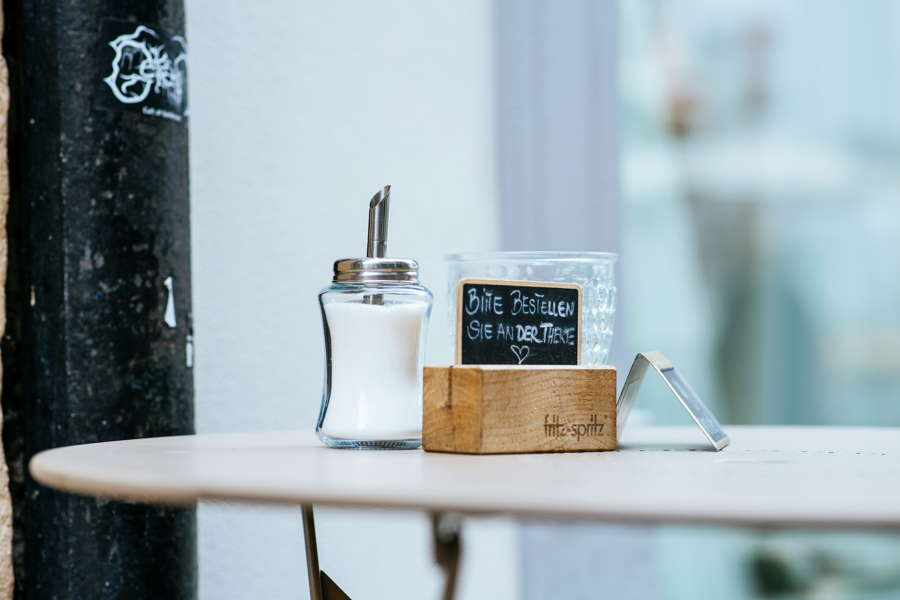 white ceramic mug on brown wooden table